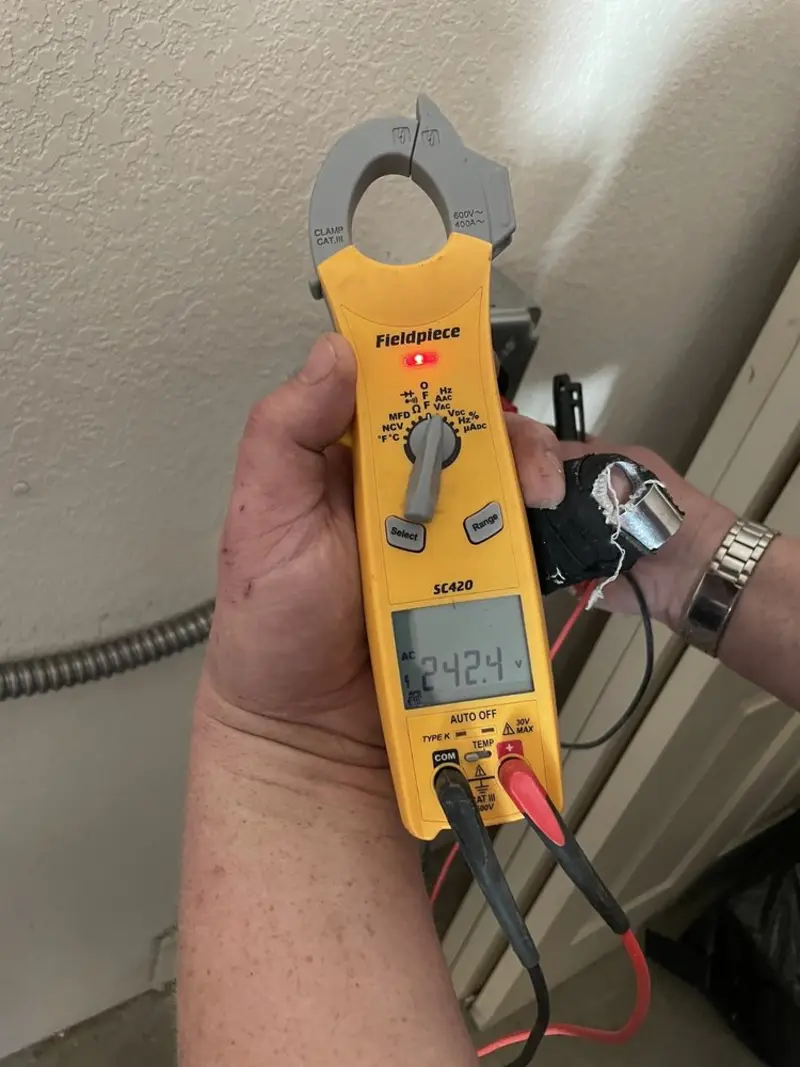 Voltage testing with clamp meter during Ceiling Fan Installation in Upland